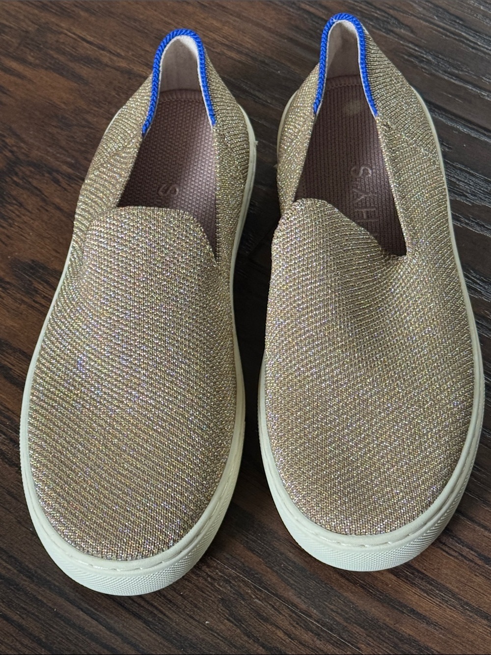 Rothy's Gold Glitter Slip-On Sneakers with Blue Trim